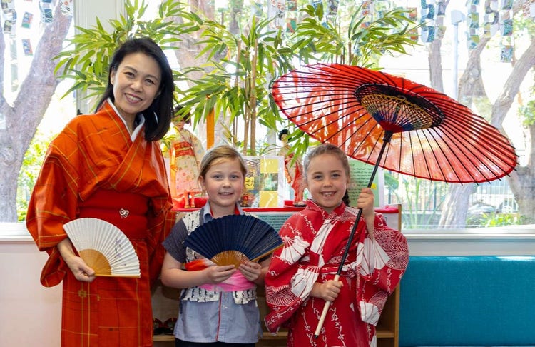 Japanese teacher and students wearing kimonos