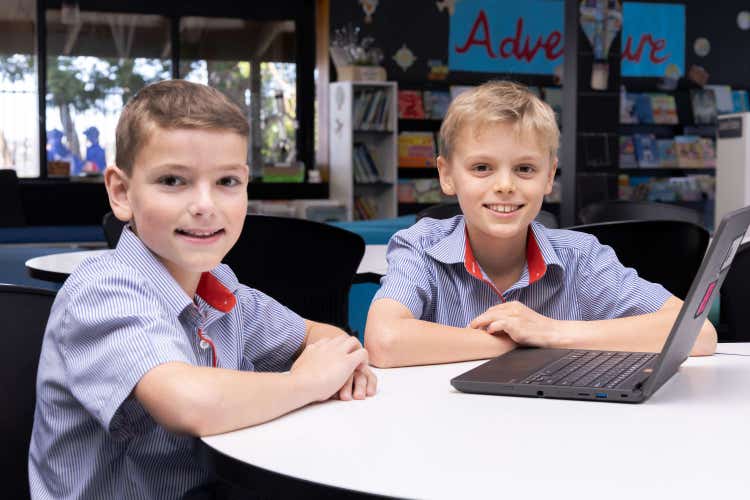 two students with laptop