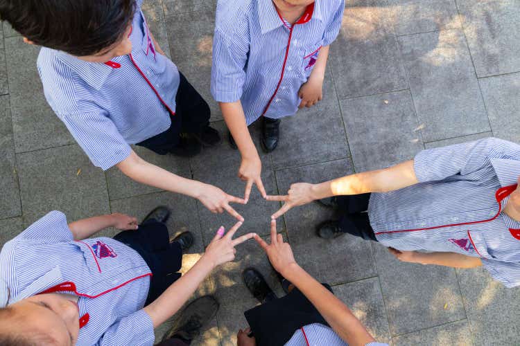 Students with hands in star shape